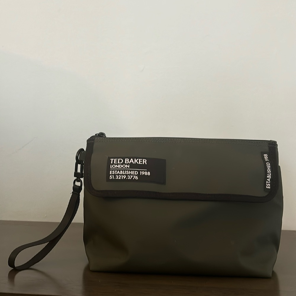 Green lightly used toiletry bag from Ted Baker Rubberised.
